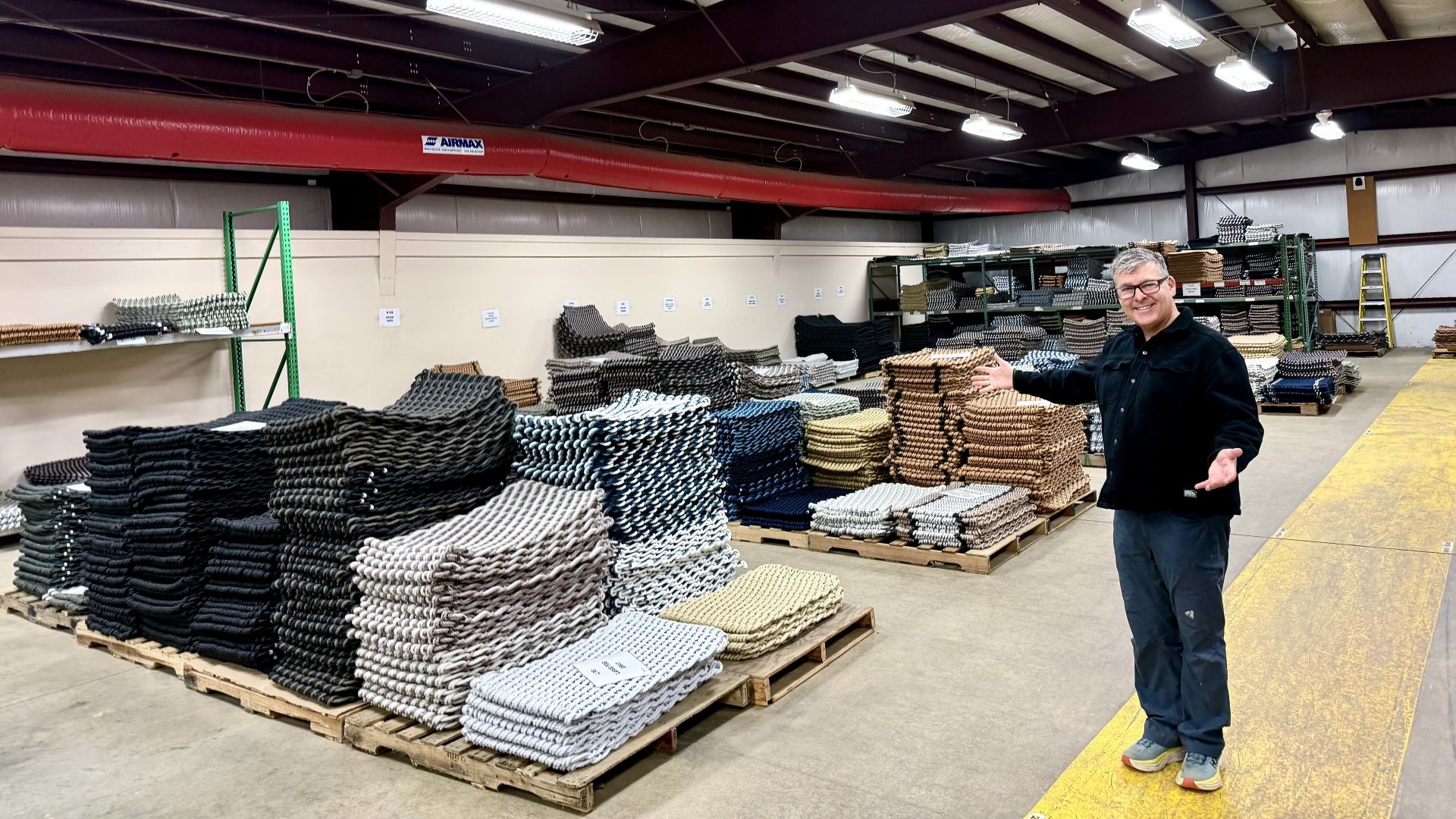 David Whitney poses for a photo with some of his inventory.