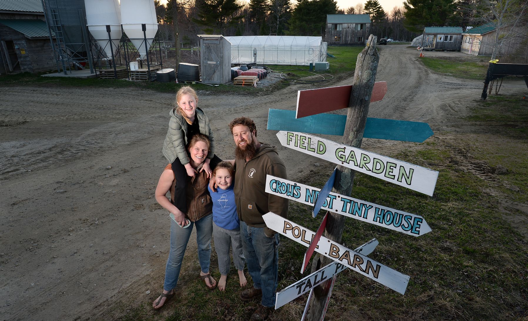 The Sinsi family poses for a photo on their farm.
