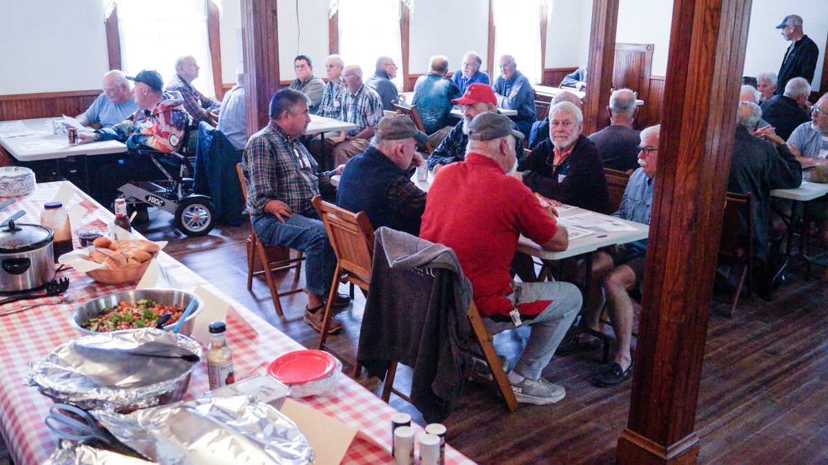 members of romeo sit at several tables. 