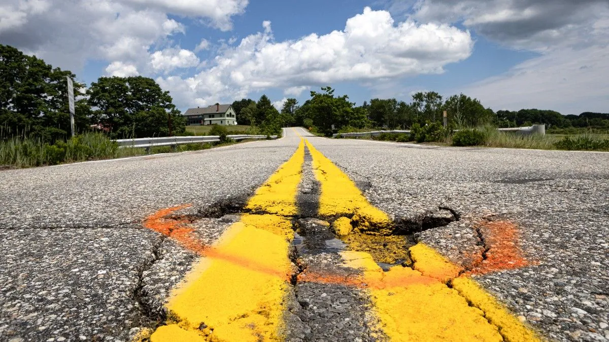 pothole marked by orange spray paint.