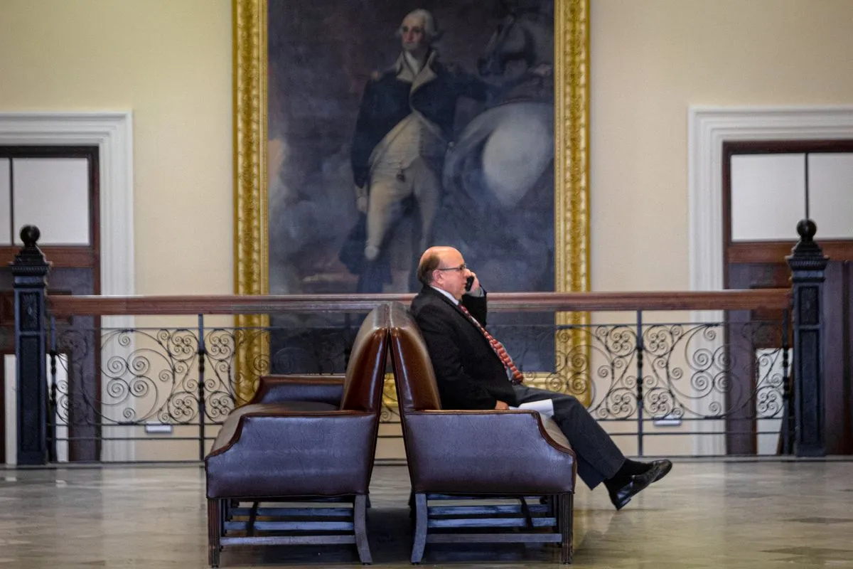 Matt Dunlap sits down while talking on the phone.