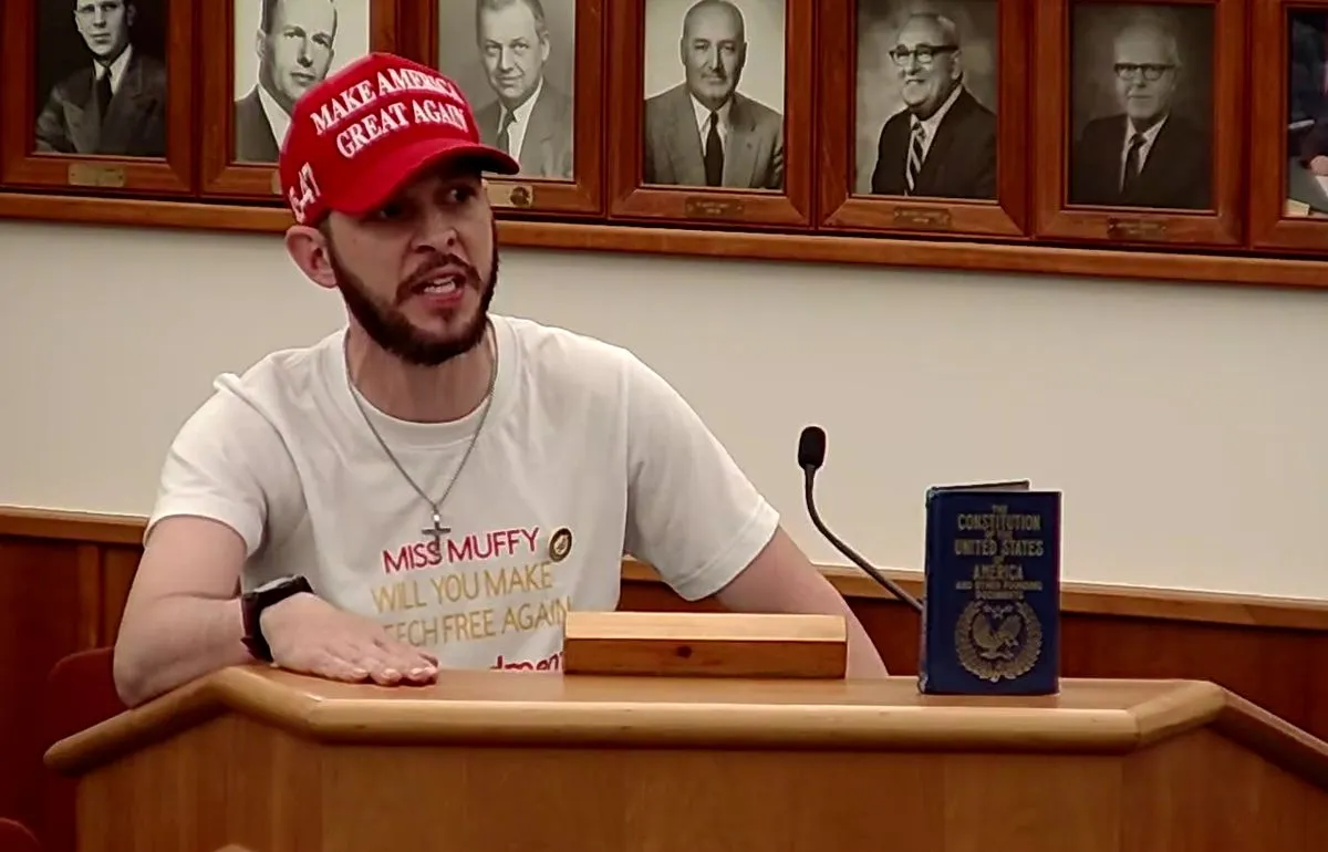 Nicholas Blanchard, also known as Corn Pop, speaks while standing at a podium.
