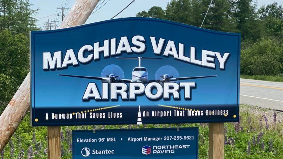 A property identification sign at the entrance of the Machias Valley Airport.