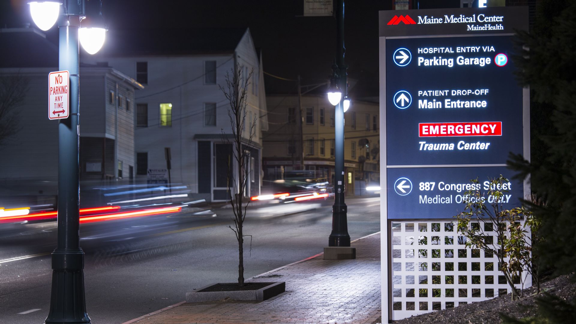 A sign outside a Maine Medical Center complex pointing individuals towards the correct buildings.