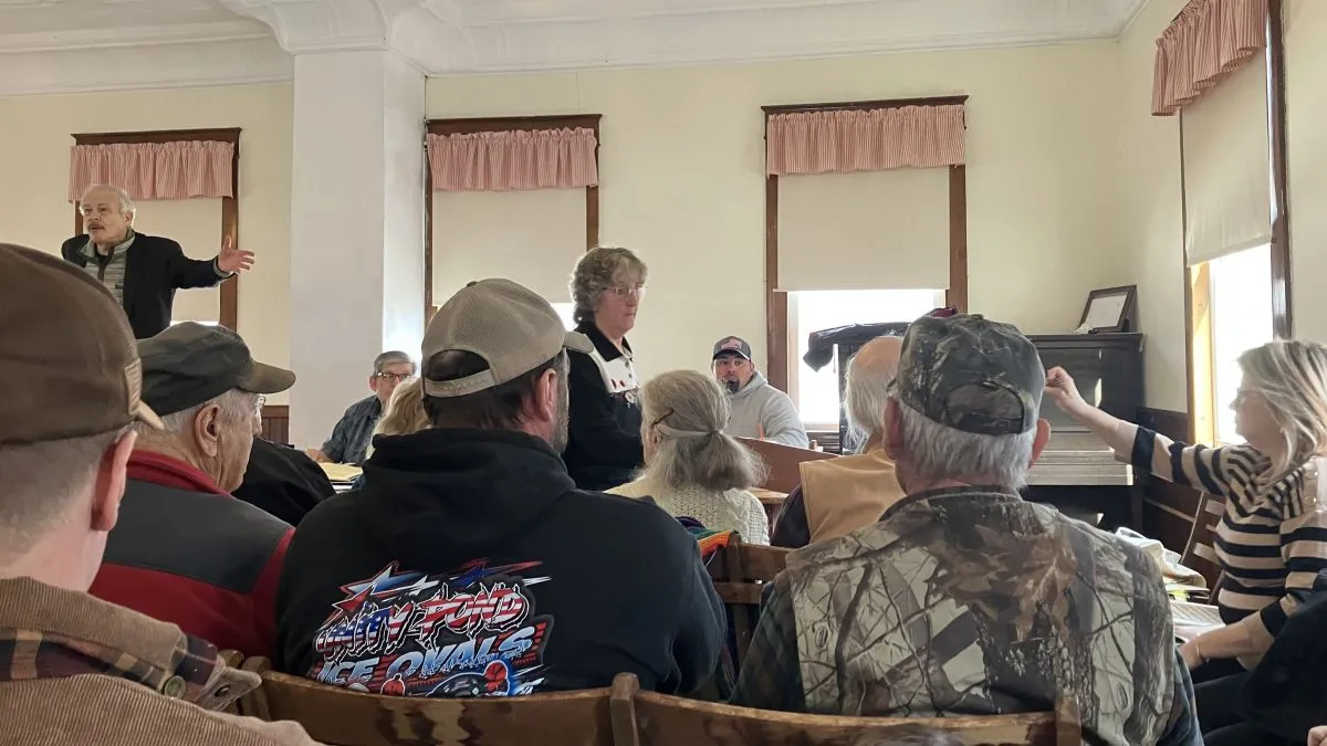 Jill Bates collects votes from the audience