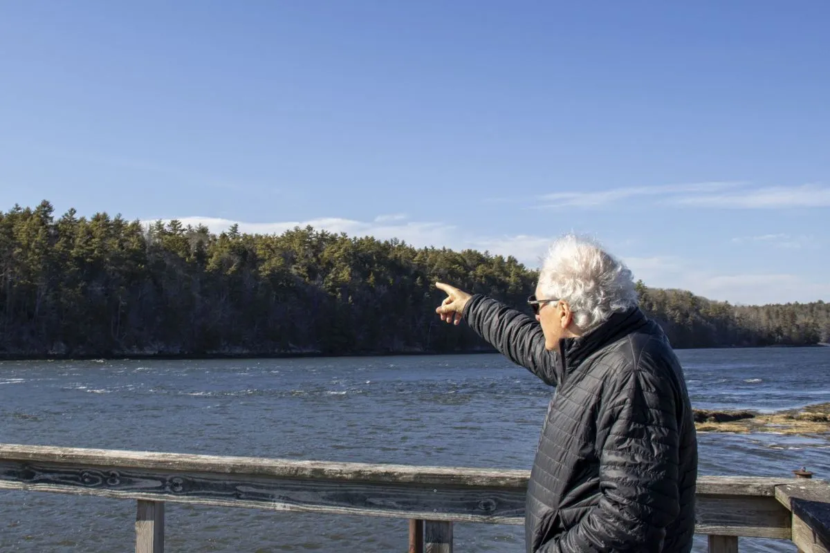 Richard Davis points to undeveloped land.