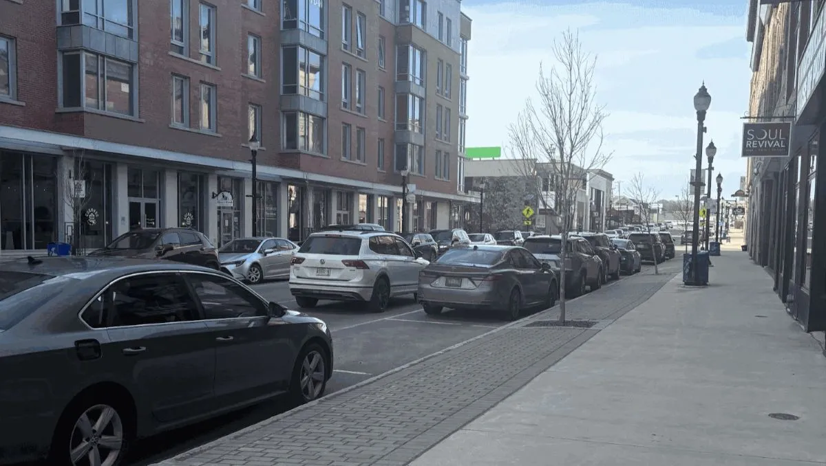 buildings line both sides of a street in downtown waterville.
