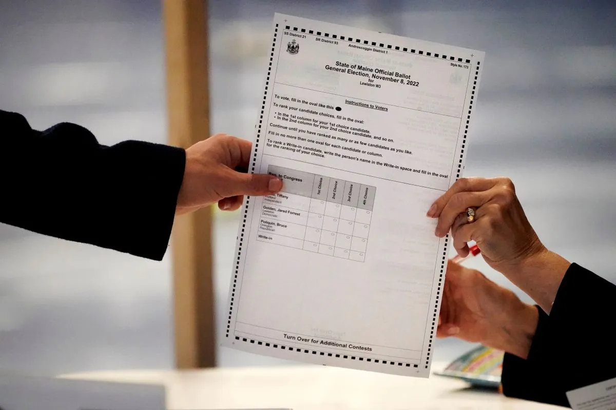 Two hands holding a ballot with ranked-choice options.