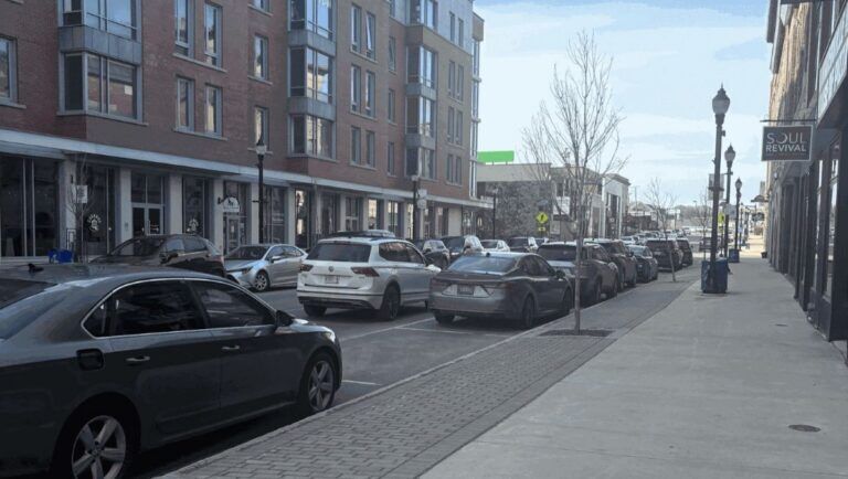 buildings line both sides of a street in downtown waterville.