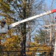 utility worker fixes power line