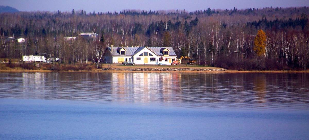 the Pelletier home as seen from across a lake