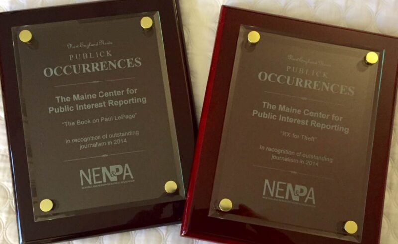 Two plaques given to the newsroom by the New England Newspaper and Press Association
