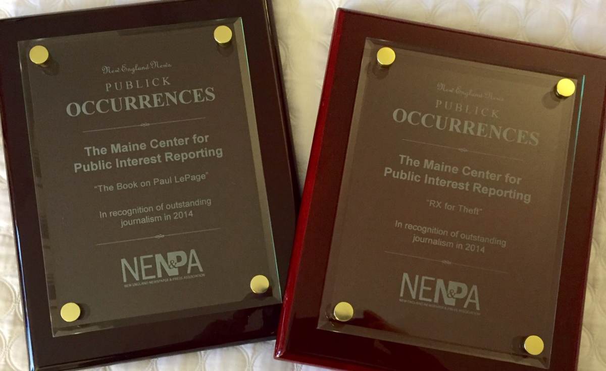 Two plaques given to the newsroom by the New England Newspaper and Press Association