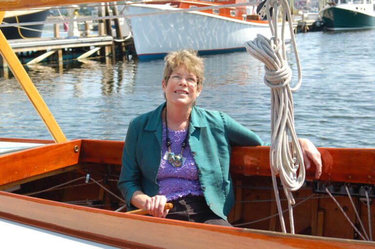 Sydney Roberts Rockefeller sits in a sailboat