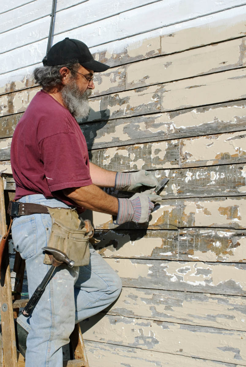 Person scraping paint