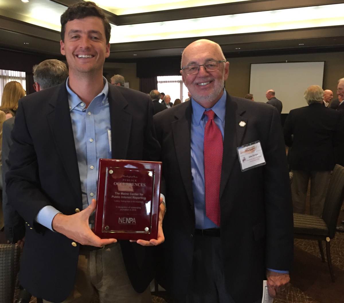 Dave Sherwood and John Christie pose for a photo after accepting an award
