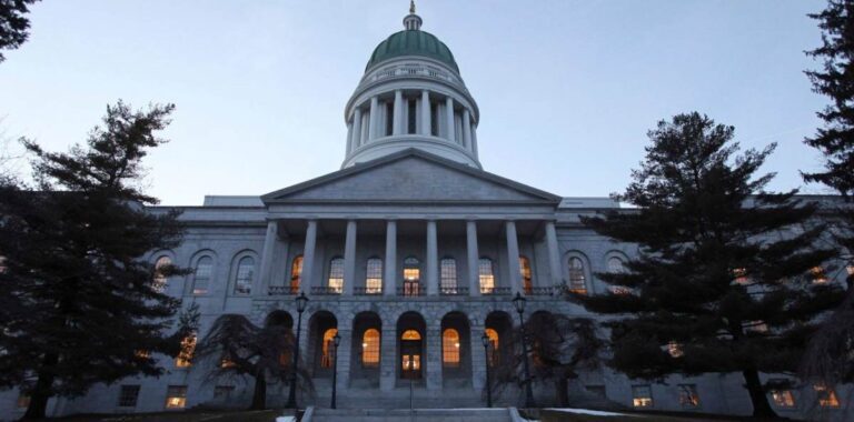 Exterior of the Maine state house as the sun sets