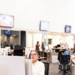 people working inside a newsroom