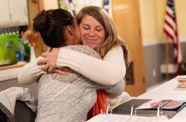 two women hug while celebrating drug-free anniversaries