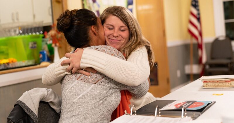 two women hug while celebrating drug-free anniversaries