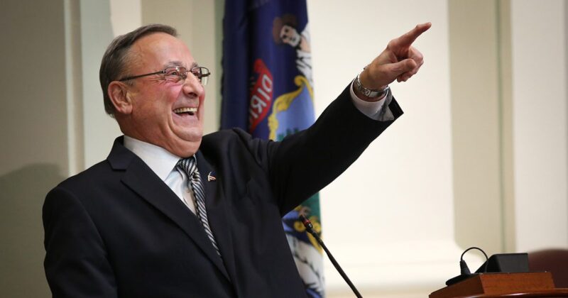 paul lepage laughs and points during a speaking event