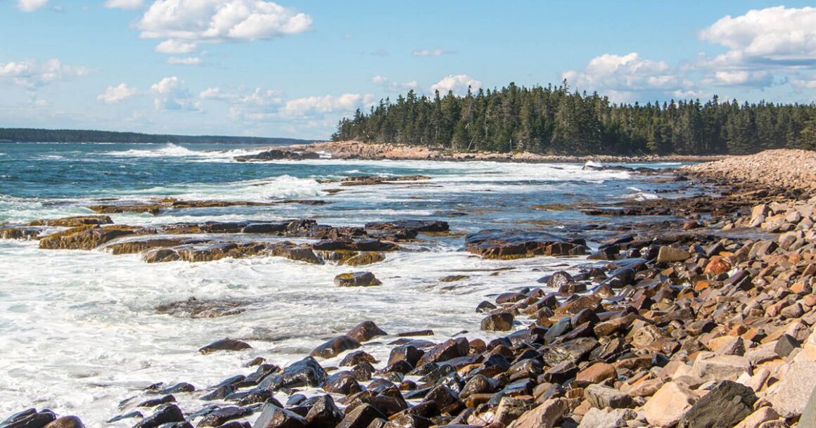 the coastline of a rocky beach island