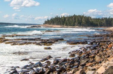 the coastline of a rocky beach island