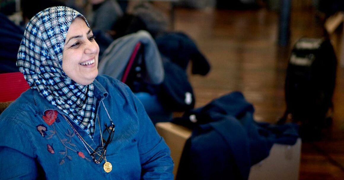 Anaam Jabbir laughing during an interaction.