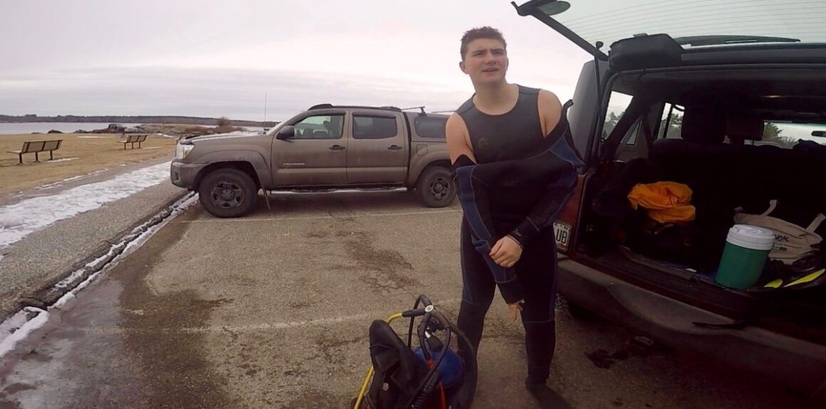 Harrison Fream removes his diving gear