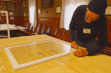 a man constructing a window insert