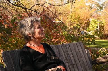 Sharon Turner sits on a bench