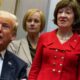 susan collins looks at and listens to donald trump speaking