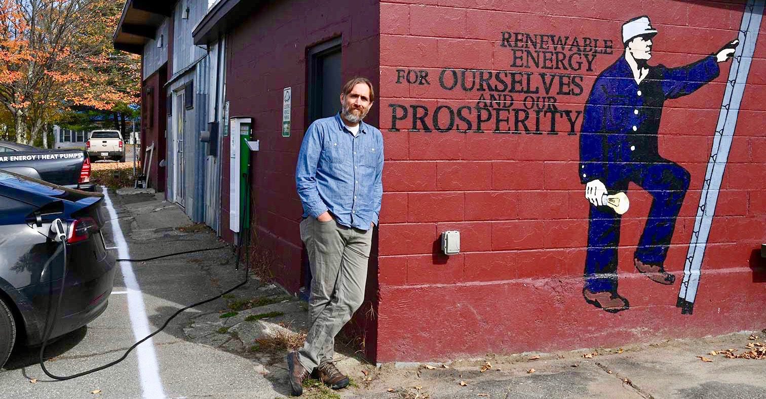Vaughan Woodruff poses for a photo while leaning against a building.