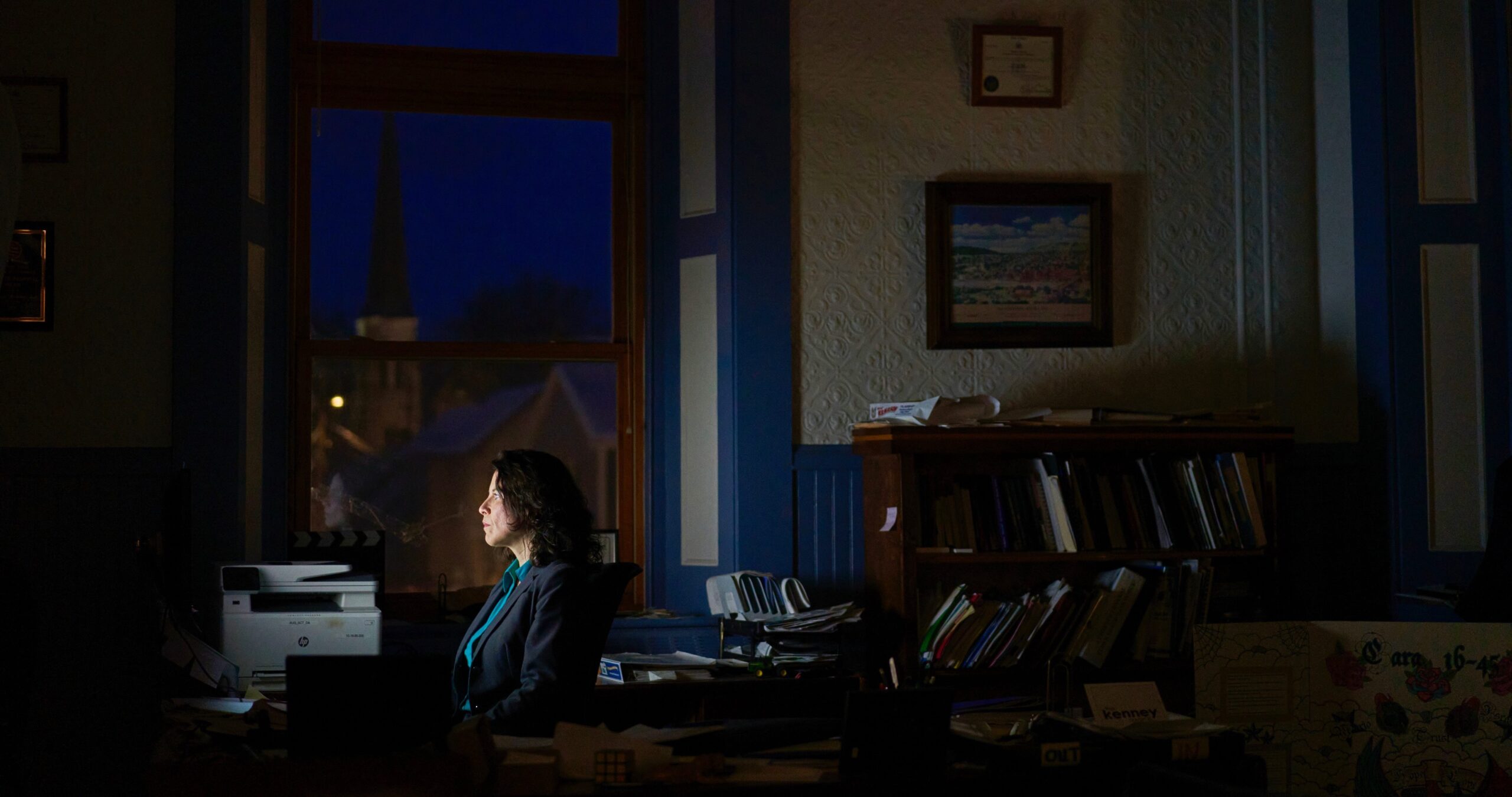 Maeghan Maloney sits at her desk late at night