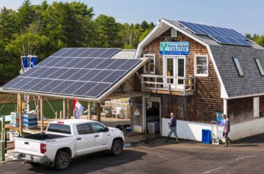 A commercial building with solar panels installed on the roof.