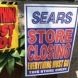 two signs about a sears location closing
