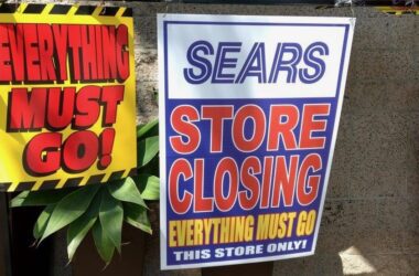 two signs about a sears location closing