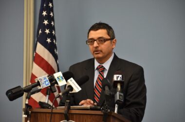 Dr. Nirav Shah stands at a podium during a press conference.