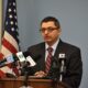 Dr. Nirav Shah stands at a podium during a press conference.