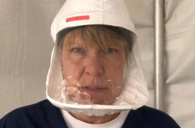 Dr. Jennifer McConnell poses for a photo while wearing a faceshield to protect her from covid-19