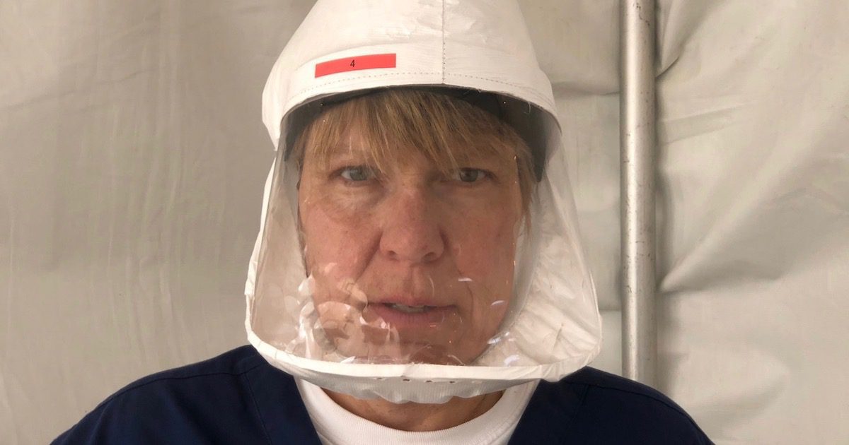 Dr. Jennifer McConnell poses for a photo while wearing a faceshield to protect her from covid-19