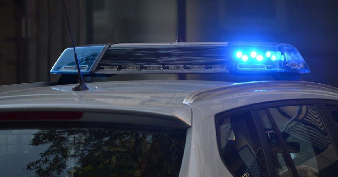 The flashing lights of a police cruiser.