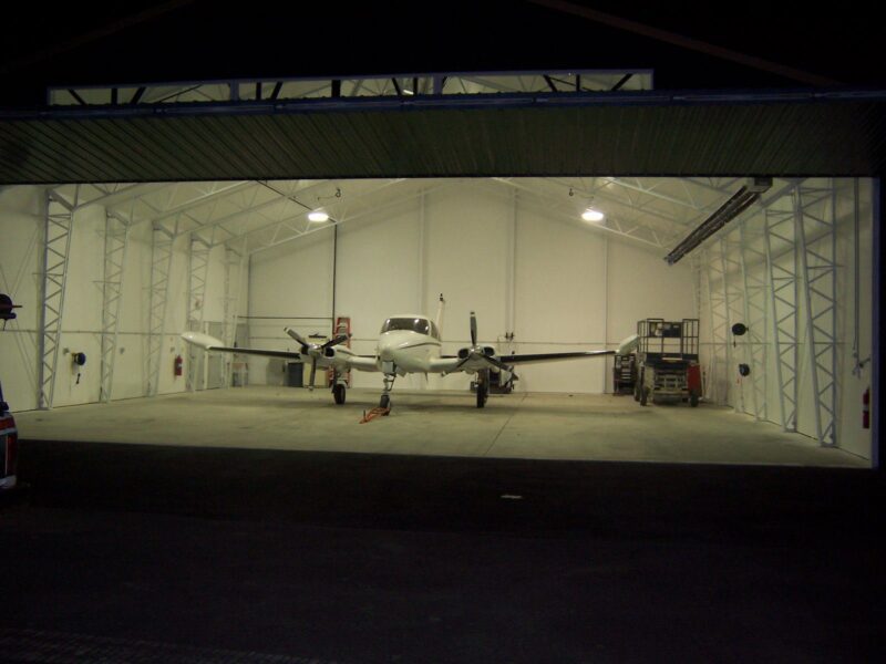 The calvary baptist church ministry plane sits in a hangar