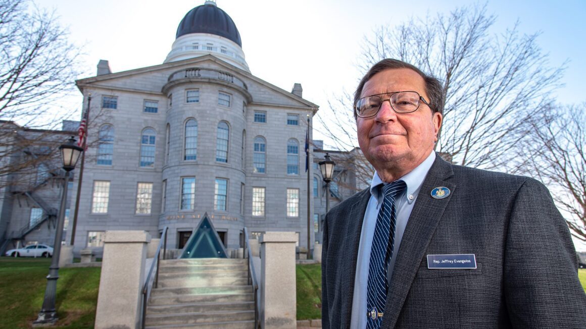 Jeff Evangelos stands in front of the State House