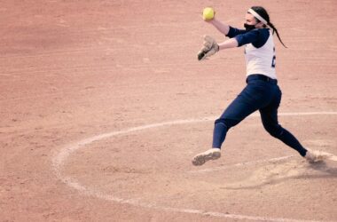 A pitcher for the University of Southern Maine softball team goes through her windup motion during a game.