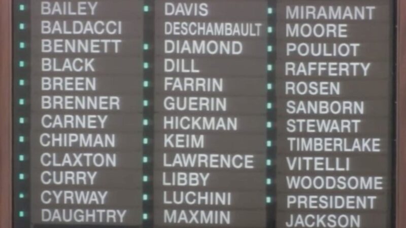 Many of the lights near state senators names on a roll call board in the Maine State Senate are lit green for affirmative votes.