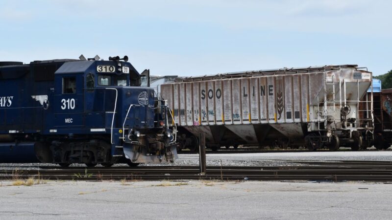 Two trains in a Waterville railyard.