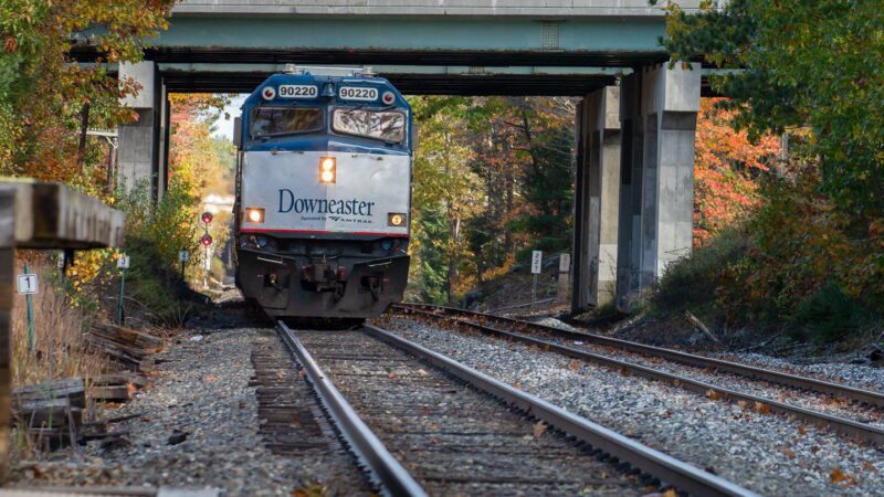 A Downeaster train prepares to pull into a station.