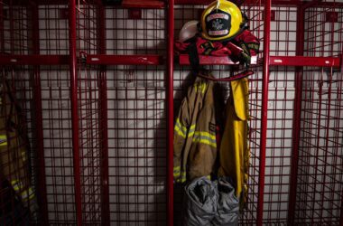 A firefighter's uniform sits and hangs in a locker within the Thorndike station.