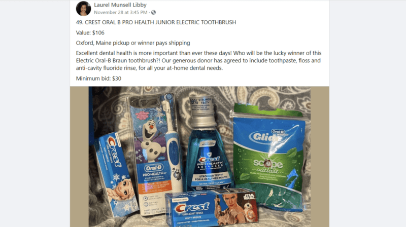 A screenshot of a Facebook post made by Laurel Munsell Libby of an auction item. The post text reads: "49. Crest Oral B Pro Health Junior Electric Toothbrush. Value $106. Oxford, Maine pickup or winner pays shipping. Excellent dental health is more important than ever these days! Who will be the lucky winner of this Electric Oral-B Braun toothbrush?! Our generous donor has agreed to include toothpaste, floss and anti-cavity fluoride rinse, for all your at-home dental needs. Minimum bid: $30." The photo attached to the Facebook post includes the five products the winning bidder will receive.